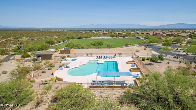 birds eye view of property featuring a mountain view