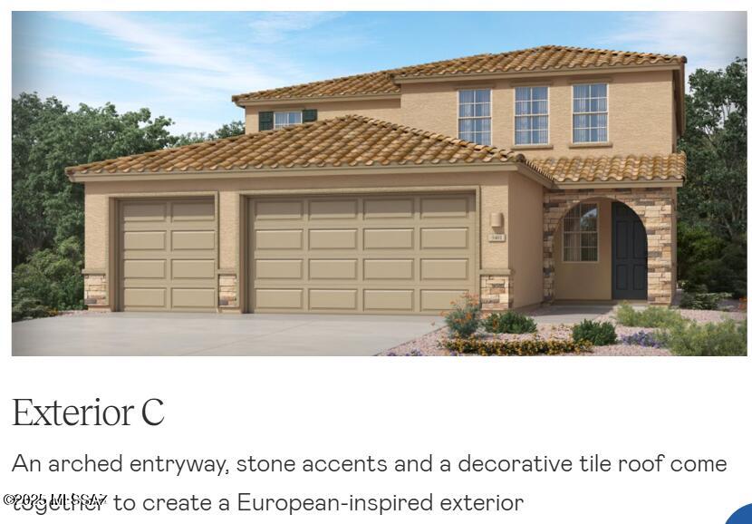 view of front of property featuring a garage, driveway, stone siding, and a tiled roof