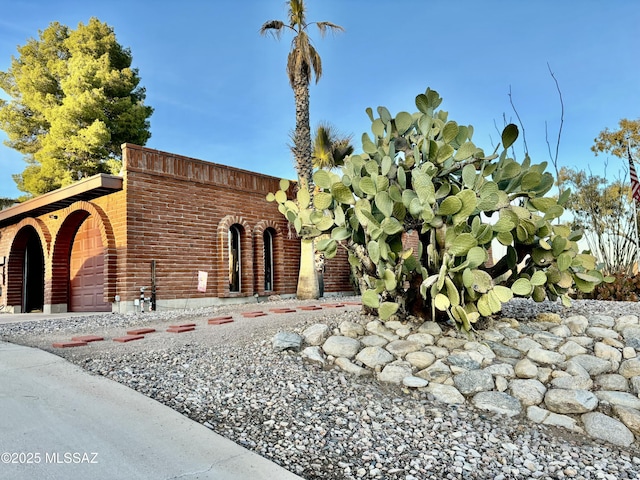 view of front of house with brick siding