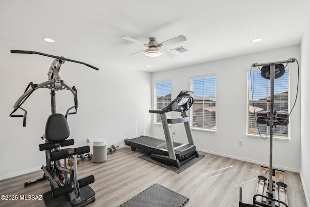 workout area with recessed lighting, baseboards, and wood finished floors