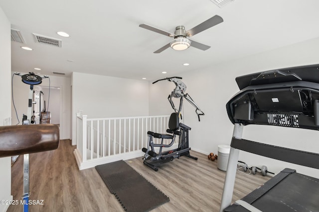 exercise room with wood finished floors, visible vents, baseboards, recessed lighting, and ceiling fan