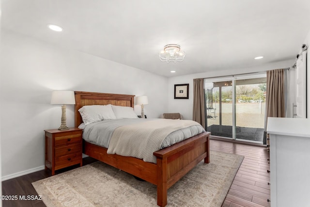 bedroom featuring access to exterior, recessed lighting, baseboards, and wood finished floors