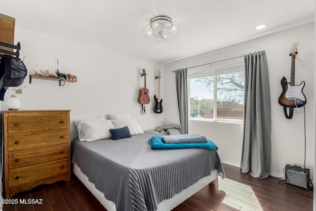 bedroom with wood finish floors, recessed lighting, and baseboards