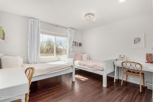 bedroom featuring dark wood-style floors