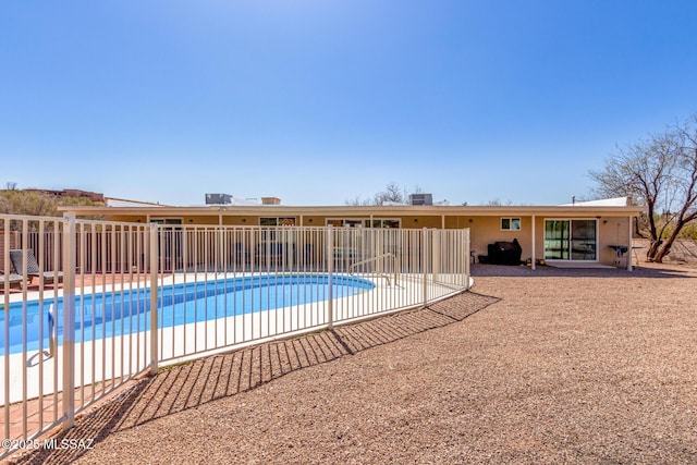 view of swimming pool with fence, a fenced in pool, and a patio