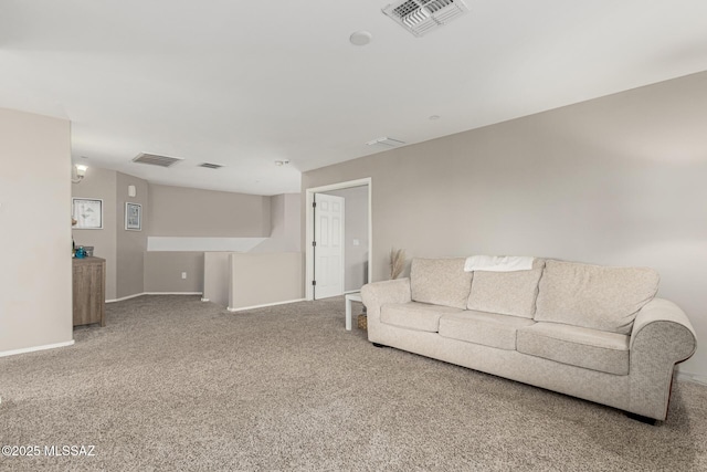 carpeted living room with visible vents and baseboards
