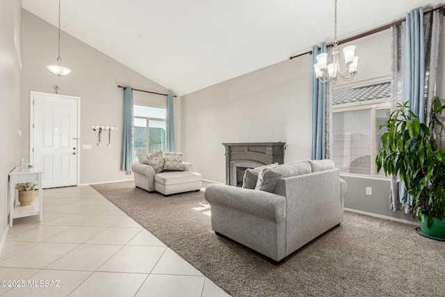 living area with baseboards, a fireplace, high vaulted ceiling, a notable chandelier, and light tile patterned flooring