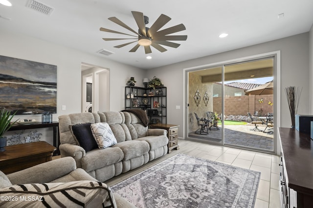 living area with a ceiling fan, recessed lighting, and visible vents