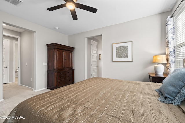 bedroom with baseboards, visible vents, ceiling fan, and light colored carpet