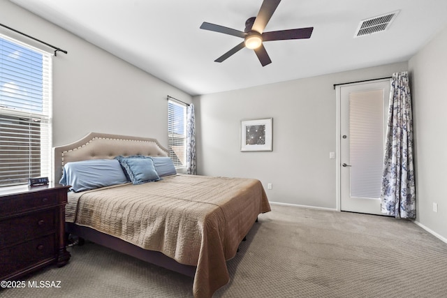 bedroom featuring ceiling fan, carpet flooring, visible vents, and baseboards