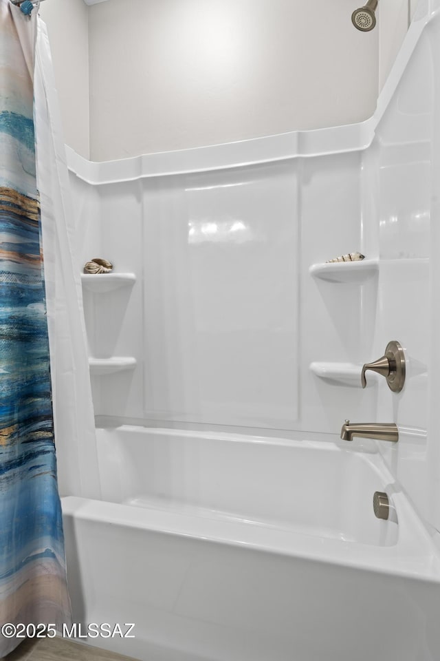 full bathroom featuring shower / tub combo with curtain