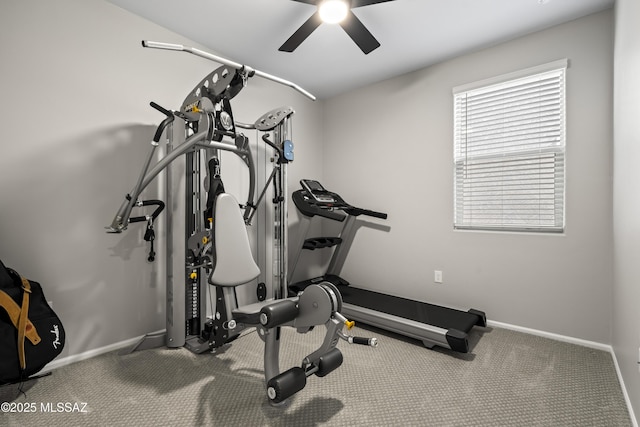 workout area with ceiling fan and baseboards