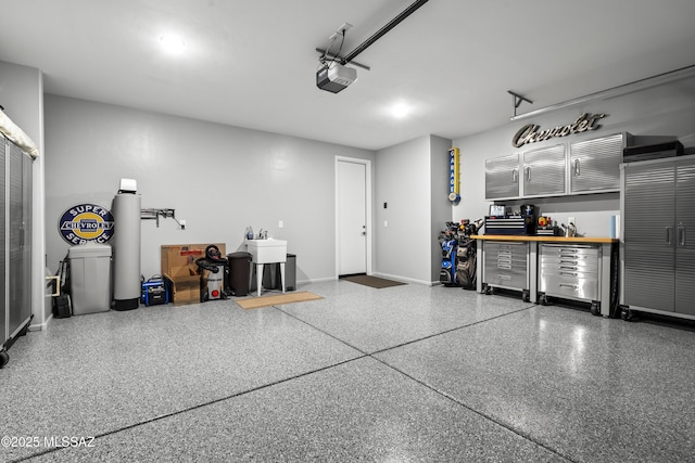 garage featuring baseboards and a garage door opener