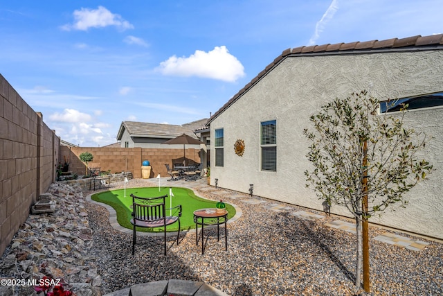 view of yard with a patio area and a fenced backyard