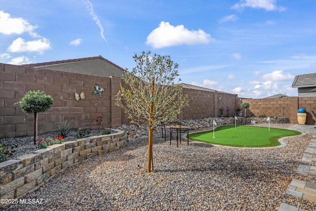 view of yard featuring a fenced backyard