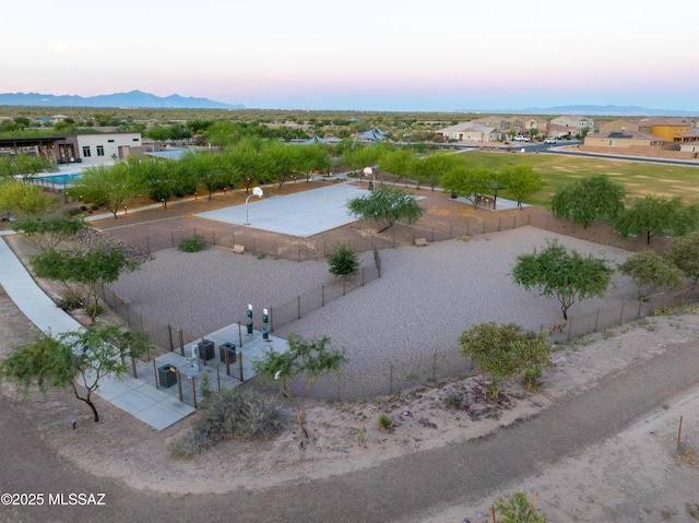 aerial view at dusk with a residential view and a mountain view