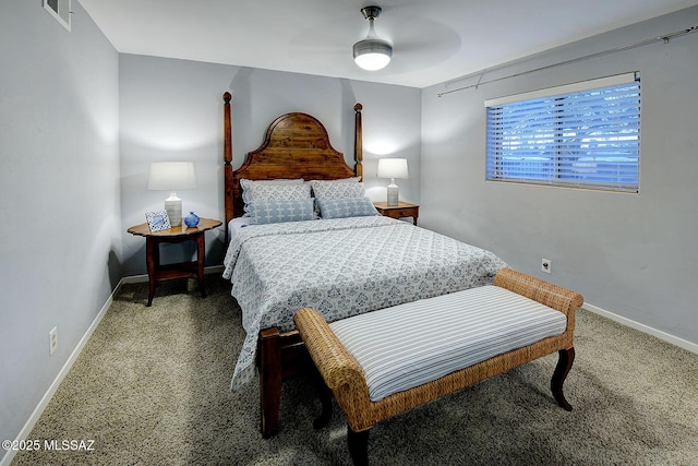 bedroom with baseboards, visible vents, and ceiling fan