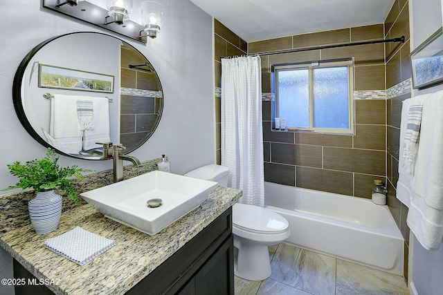 full bath with shower / bath combo, vanity, and toilet