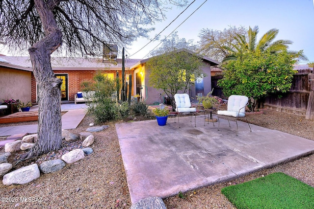 view of patio / terrace featuring fence