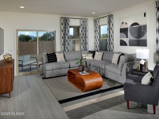 living area with plenty of natural light, recessed lighting, and wood finish floors