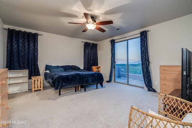 bedroom featuring access to outside, carpet floors, visible vents, and a ceiling fan