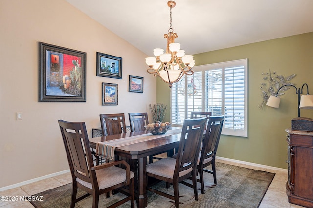 dining area featuring light tile patterned flooring, vaulted ceiling, baseboards, and an inviting chandelier