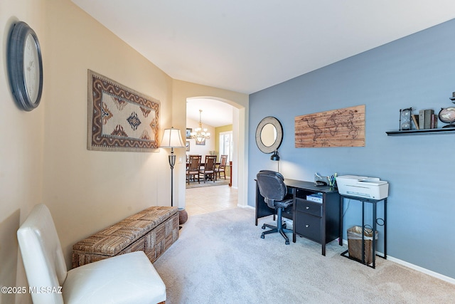 tiled office featuring arched walkways, carpet, an inviting chandelier, and baseboards