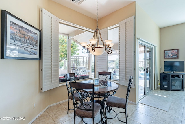 dining room featuring light tile patterned floors, baseboards, visible vents, and a notable chandelier