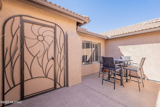 view of patio featuring outdoor dining area