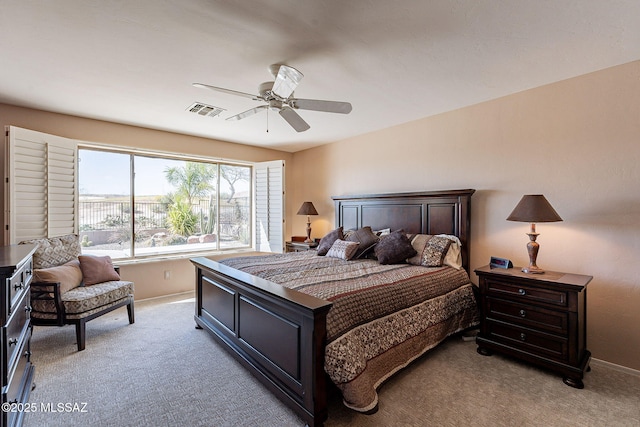 bedroom featuring light carpet, ceiling fan, visible vents, and baseboards