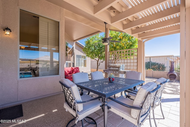 view of patio featuring outdoor dining space, fence, area for grilling, and a pergola