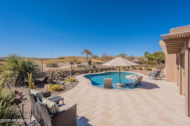 view of pool featuring a patio area, a fenced backyard, a fenced in pool, and a pergola