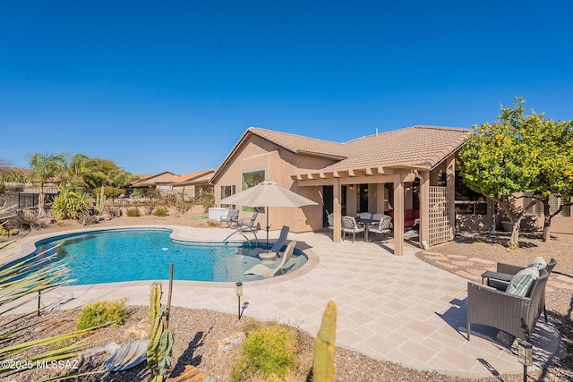 view of pool featuring a patio area, a fenced backyard, and a fenced in pool