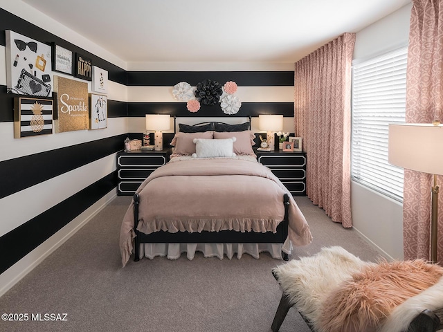 bedroom featuring baseboards and light colored carpet