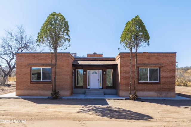 view of front of property featuring brick siding