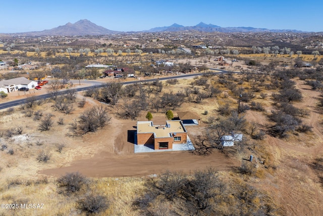 bird's eye view with a desert view and a mountain view