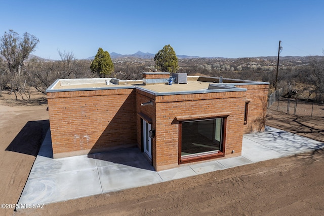 view of storm shelter with a mountain view