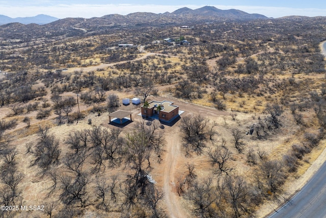 birds eye view of property featuring a mountain view