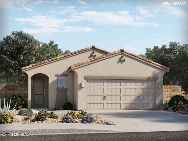 mediterranean / spanish-style home featuring stucco siding, driveway, a garage, and fence