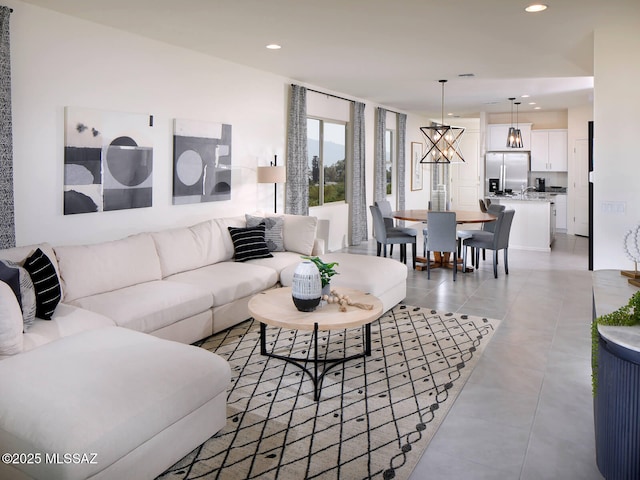 living area featuring light tile patterned floors and recessed lighting