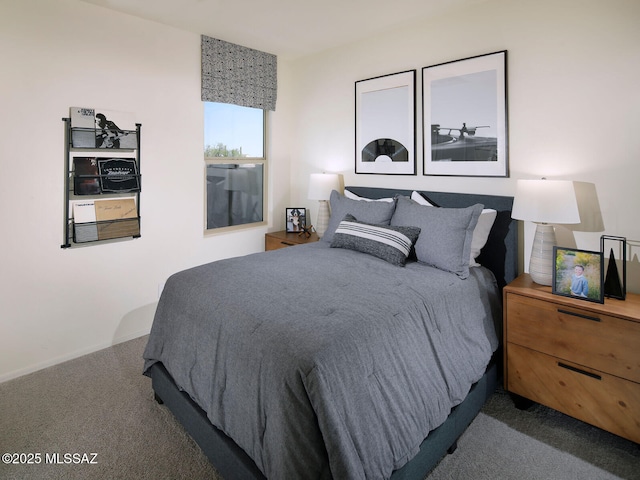 carpeted bedroom with baseboards