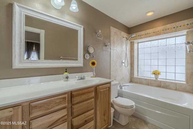 bathroom featuring bathtub / shower combination, toilet, vanity, tile patterned flooring, and a textured wall