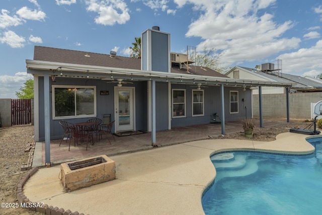 back of house featuring a fenced backyard, central air condition unit, ceiling fan, and a patio