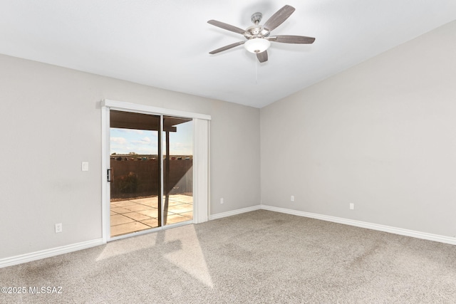 carpeted empty room with a ceiling fan and baseboards