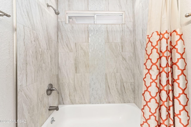 bathroom featuring shower / bath combo with shower curtain