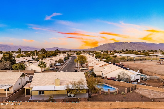 birds eye view of property with a mountain view and a residential view