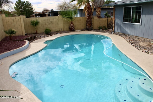 view of swimming pool featuring fence and a fenced in pool