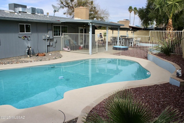 view of pool featuring fence, a fenced in pool, and a patio