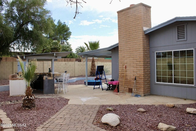 view of patio / terrace with fence