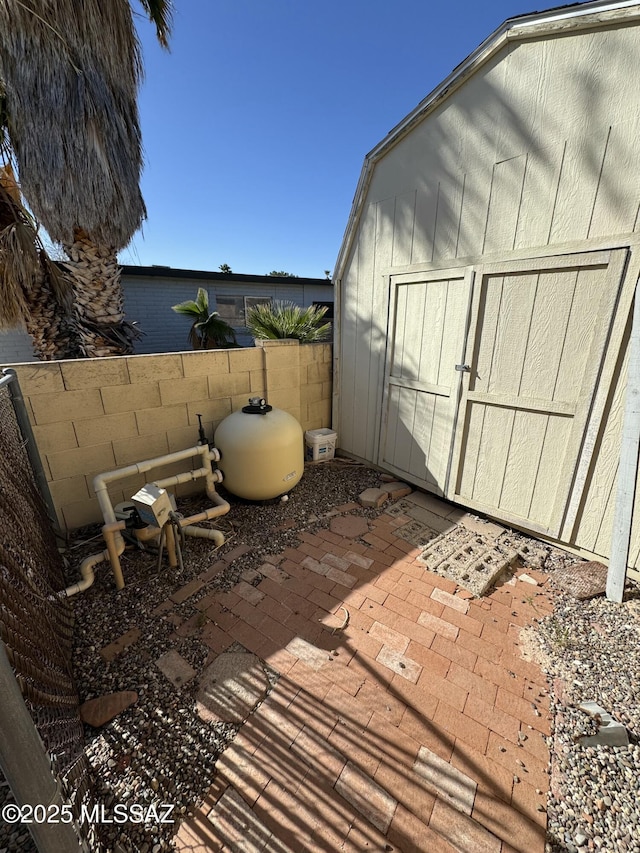 view of shed featuring a fenced backyard